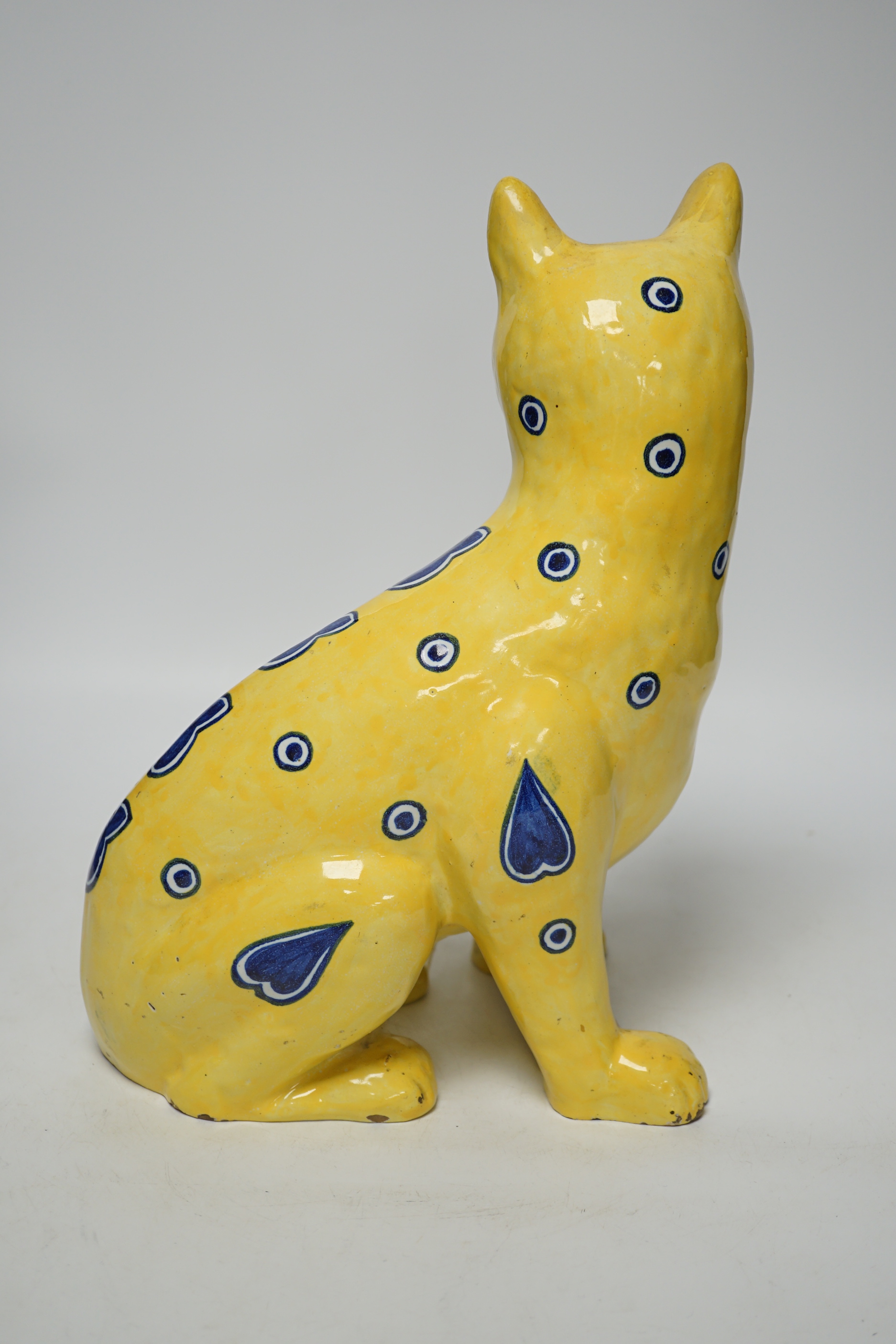 A Mosanic Galle style faience seated cat with glass eyes, c.1900-10, 31cm